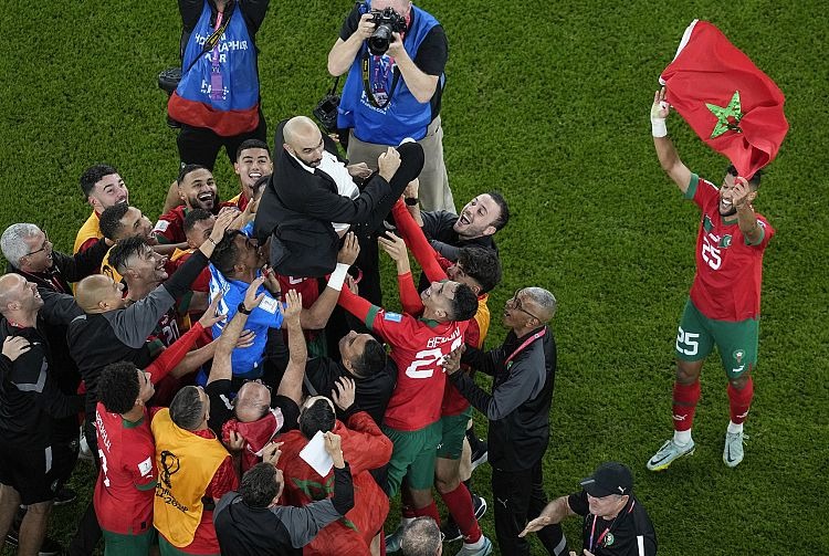 Morocco's players hail their coach Walid Regragui - Thanassis Stavrakis/Copyright 2022 The AP. All rights reserved