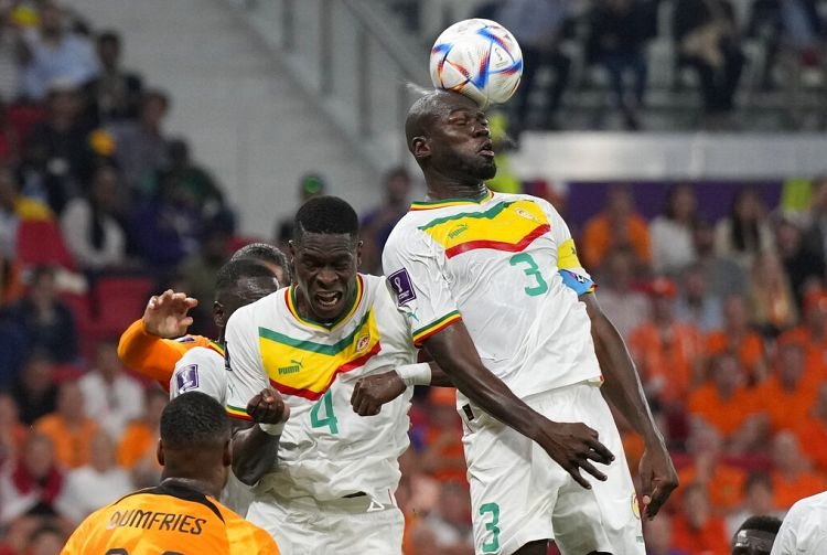 Kalidou Koulibaly heads the ball into Qatar Ricardo Mazalan/Copyright 2022 The AP. All rights reserved